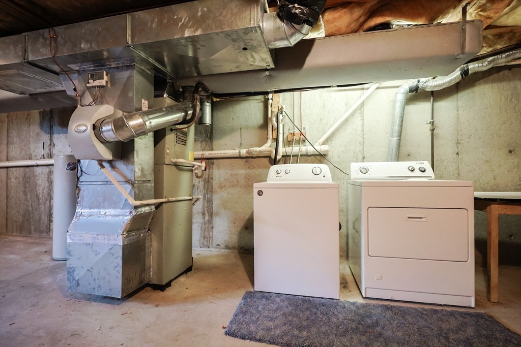 22 Deer Path, Unit 6 Maynard, MA 01754 - Photo 29 of 34 a utility room with dryer and washer