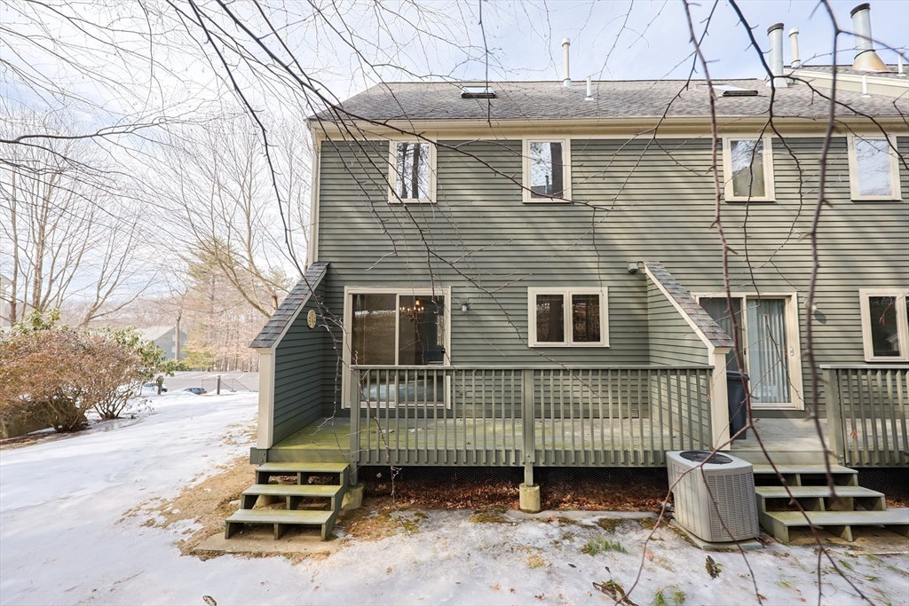 22 Deer Path, Unit 6 Maynard, MA 01754 - Photo 30 of 34 a view of a house with a yard