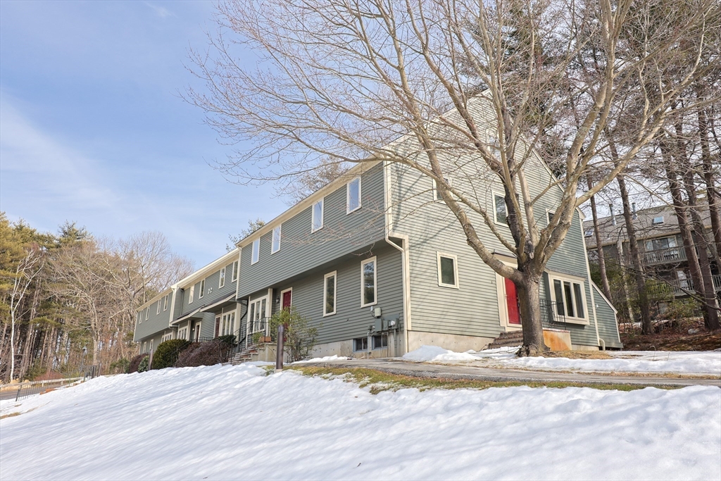 22 Deer Path, Unit 6 Maynard, MA 01754 - Photo 32 of 34 a view of a house with snow on the road