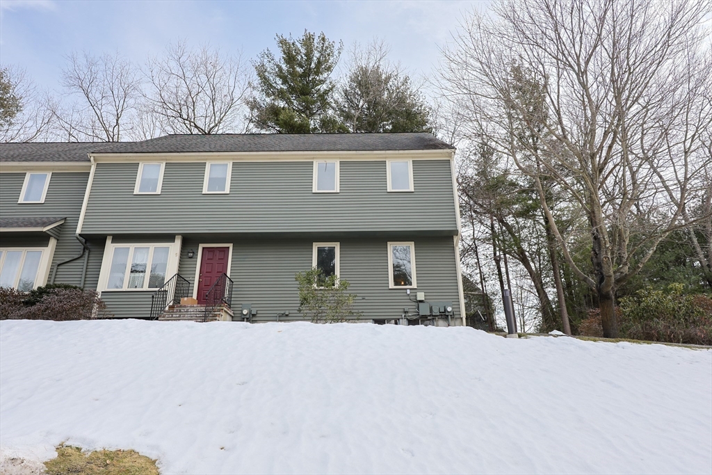 22 Deer Path, Unit 6 Maynard, MA 01754 - Photo 33 of 34 a front view of a house with a yard
