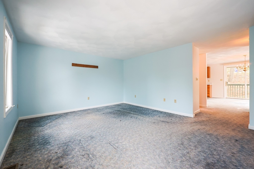 22 Deer Path, Unit 6 Maynard, MA 01754 - Photo 4 of 34 an empty room with windows