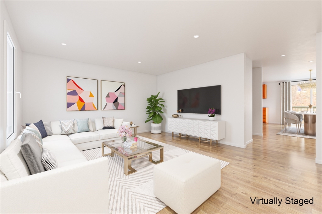 22 Deer Path, Unit 6 Maynard, MA 01754 - Photo 5 of 34 a living room with furniture and a flat screen tv