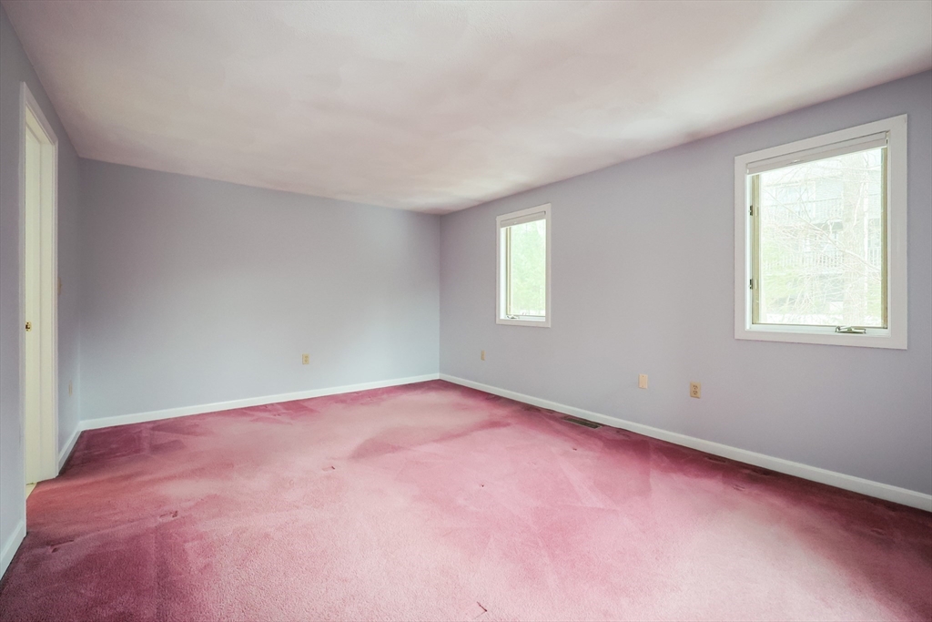 22 Deer Path, Unit 6 Maynard, MA 01754 - Photo 8 of 34 an empty room with windows