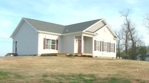 3802 Morgans Mill Road Goodview, VA 24095 - Photo 1 of 6 a front view of a house with a yard