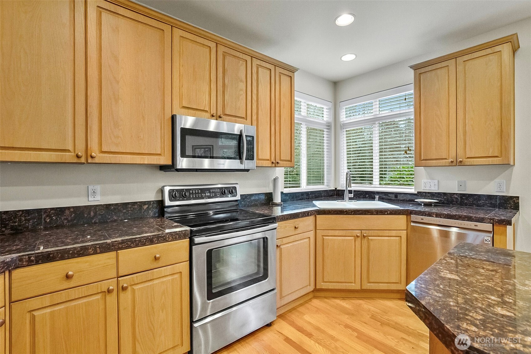 17401 33rd Drive Southeast Bothell, WA 98012 - Photo 15 of 39 a kitchen with a stove a sink and a microwave