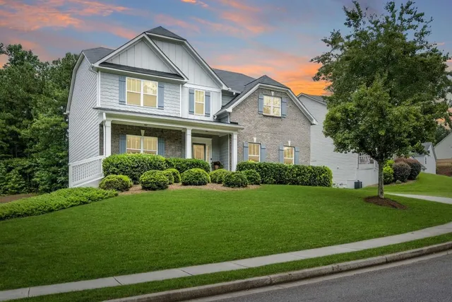 a front view of a house with a yard