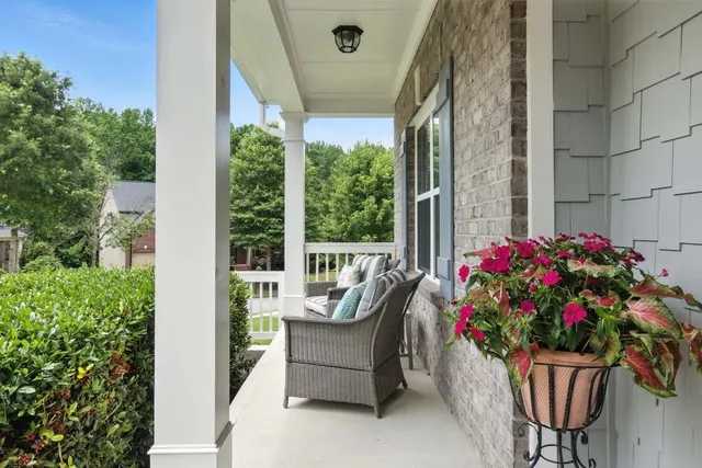 a garden with flowers and table