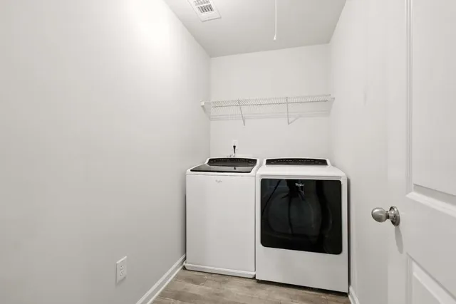 a utility room with washing machine