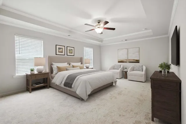 a spacious bedroom with a bed and a couch