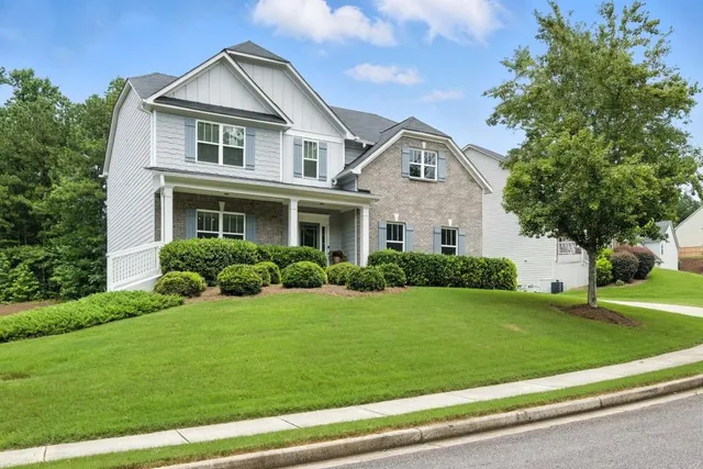 a front view of a house with a yard