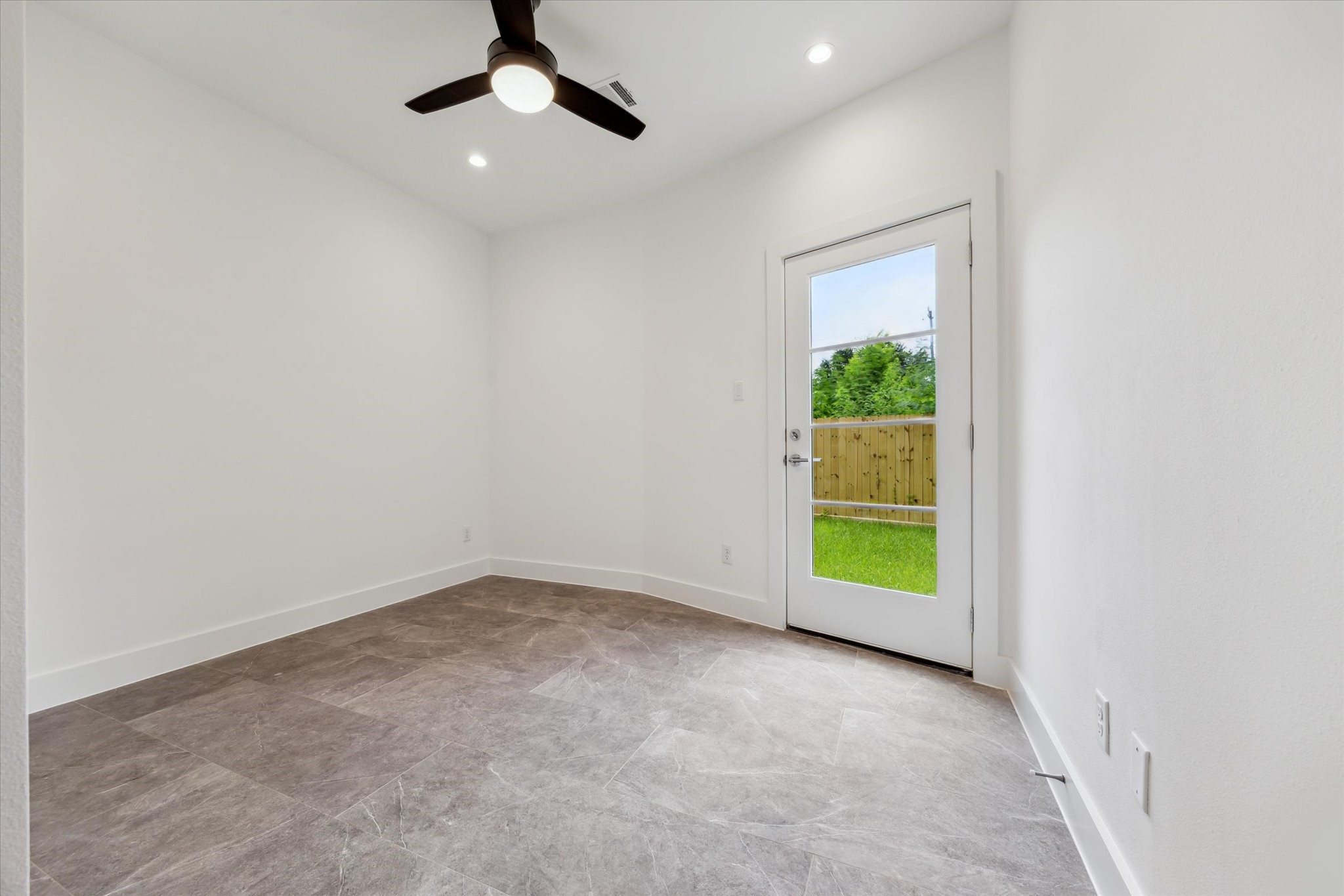 5309 Eigel Street Houston, TX 77007 - Photo 37 of 41 Bedroom on the First Floor * Porcelain Tile * Leads to Backyard.