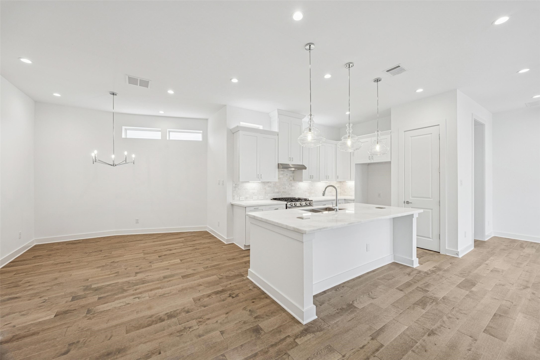 5309 Eigel Street Houston, TX 77007 - Photo 9 of 41 All Open * Kitchen is Light and Bright * White Cabinets * Marble Counters * Stainless Steel Appliances.