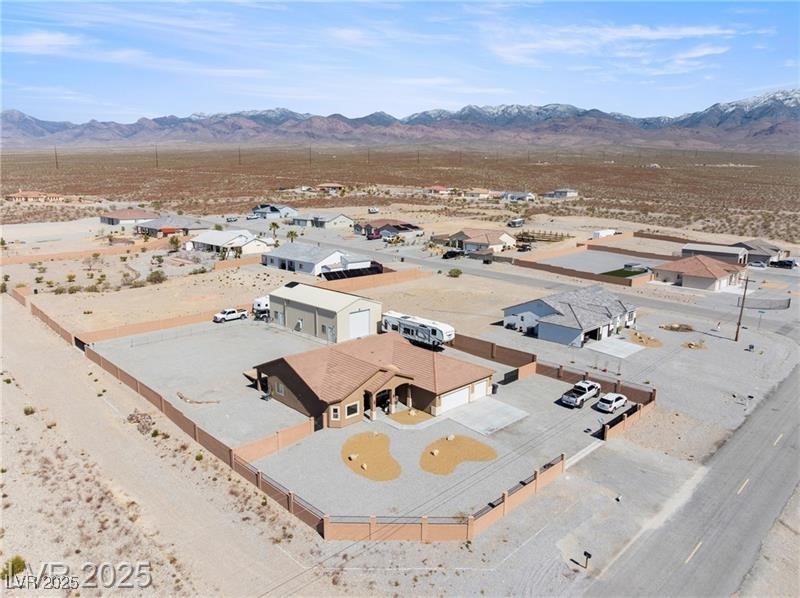 760 Fort Churchill Road Pahrump, NV 89060 - Photo 29 of 33 Aerial view of residential area with a desert landscape and a mountain backdrop
