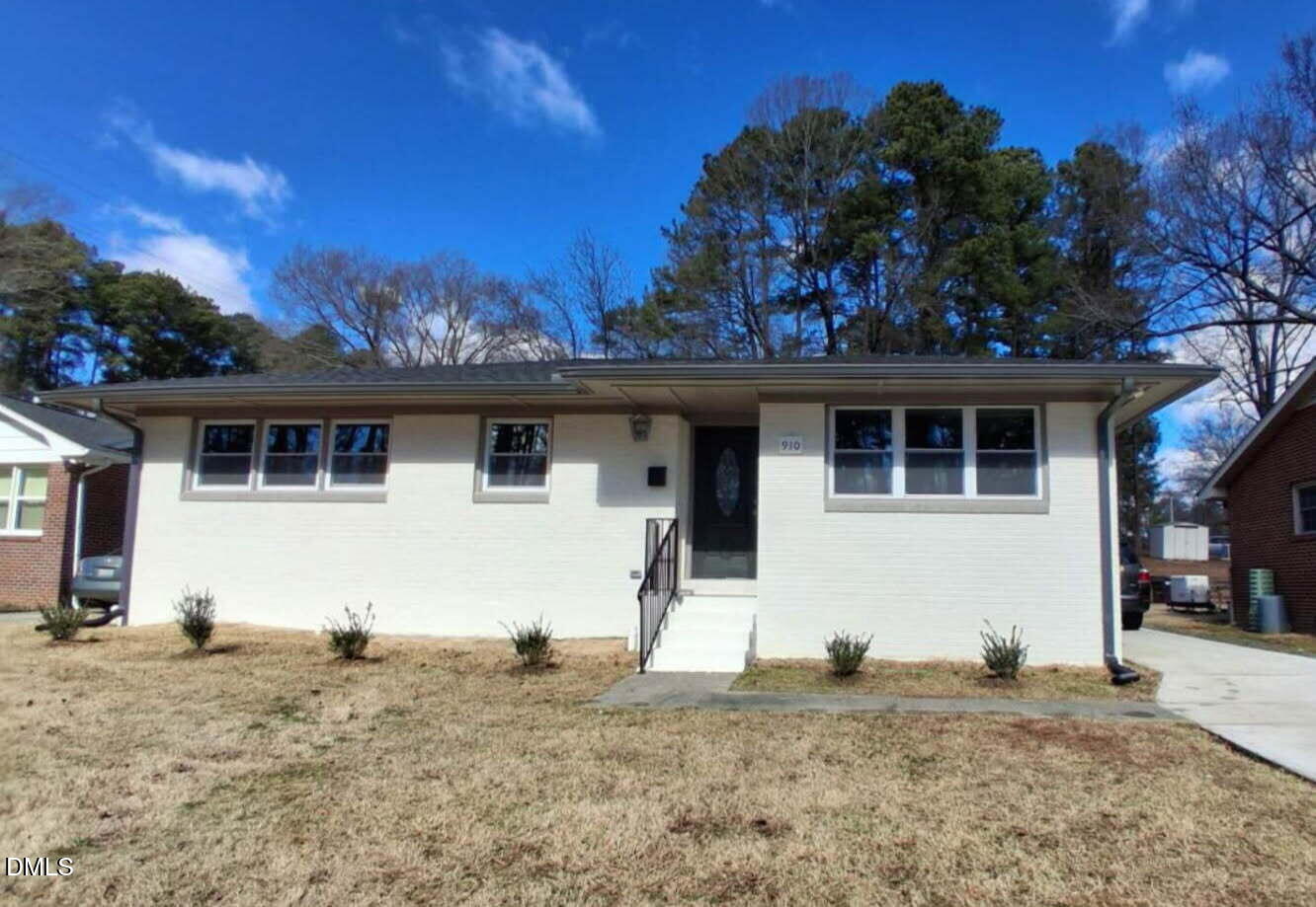 a view of a house with a snow in the background