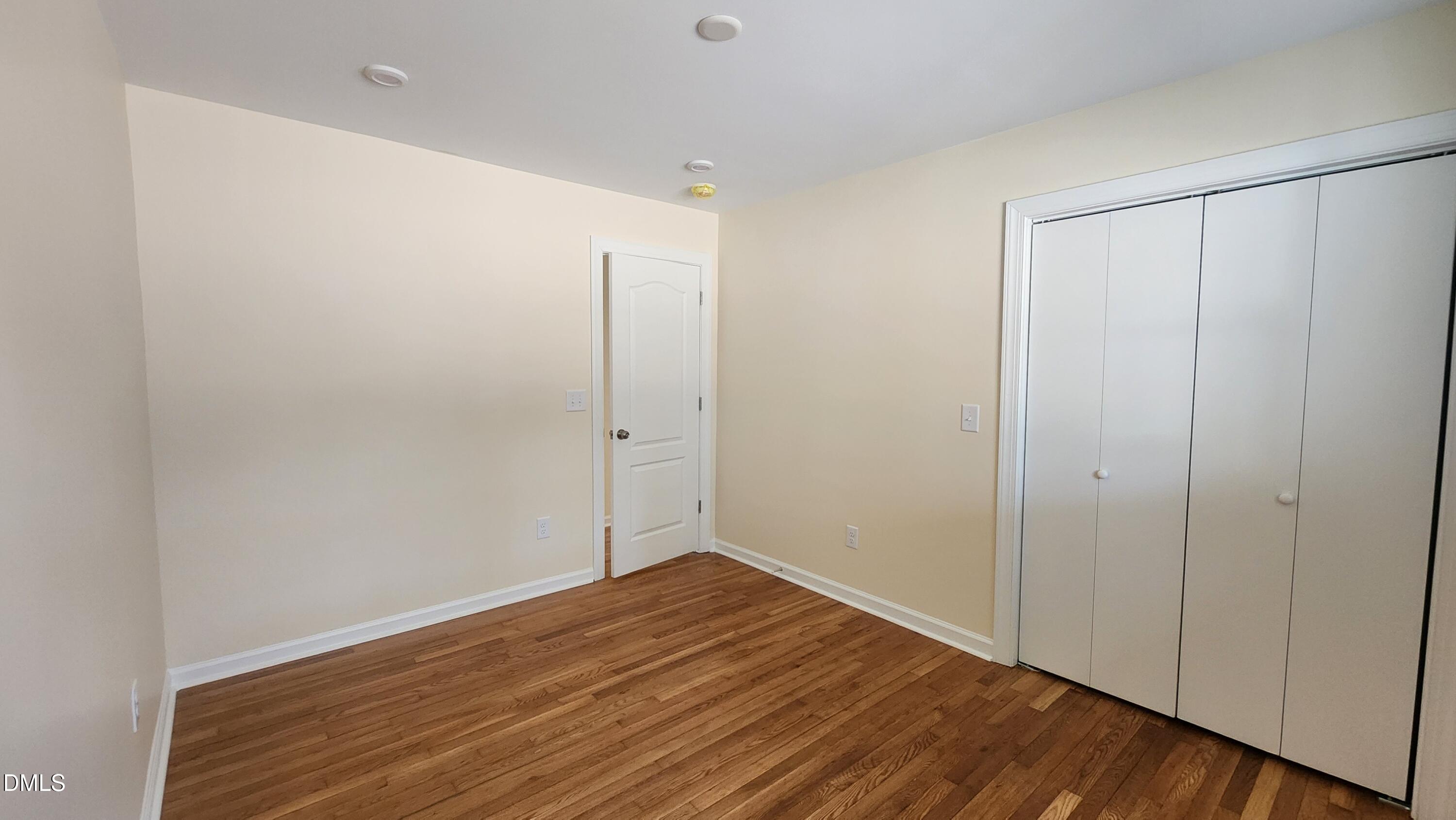 910 Ruby Street Durham, NC 27704 - Photo 8 of 16 a view of an empty room with wooden floor