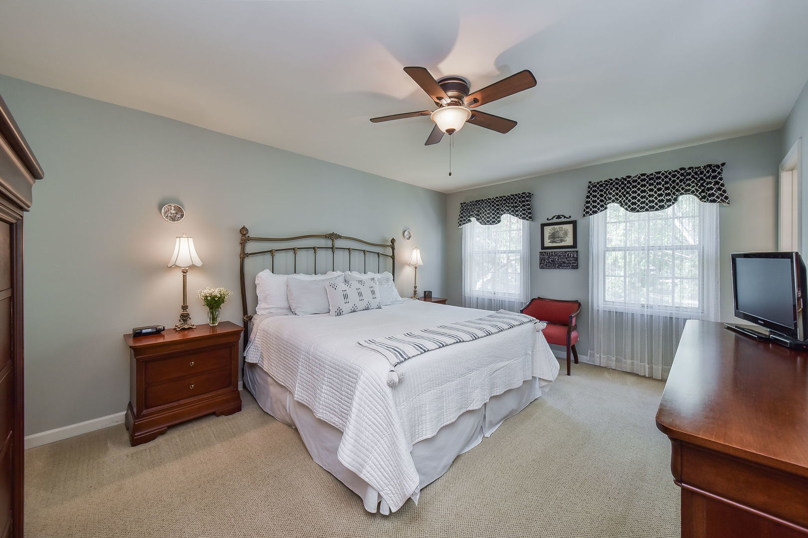 1213 West Bauer Road Naperville, IL 60563 - Photo 12 of 27 a bedroom with a bed chandelier and a window