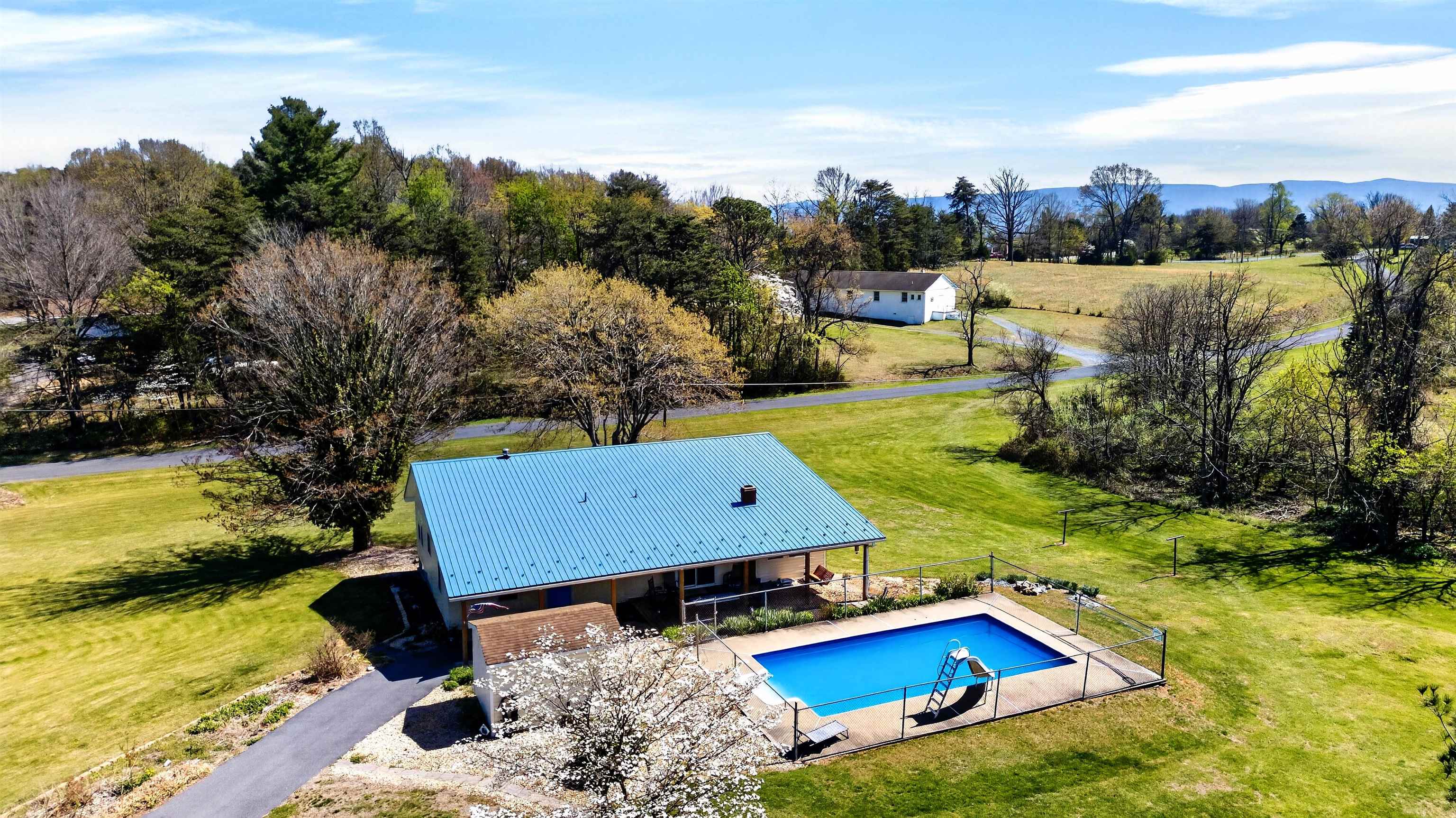 22 Oak Ridge Lane Staunton, VA 24401 - Photo 1 of 62 Beautifully positioned on 1.59 mostly level acres, this one-level home offers open space, a fenced in-ground pool, and a peaceful setting with mountain views in the distance.