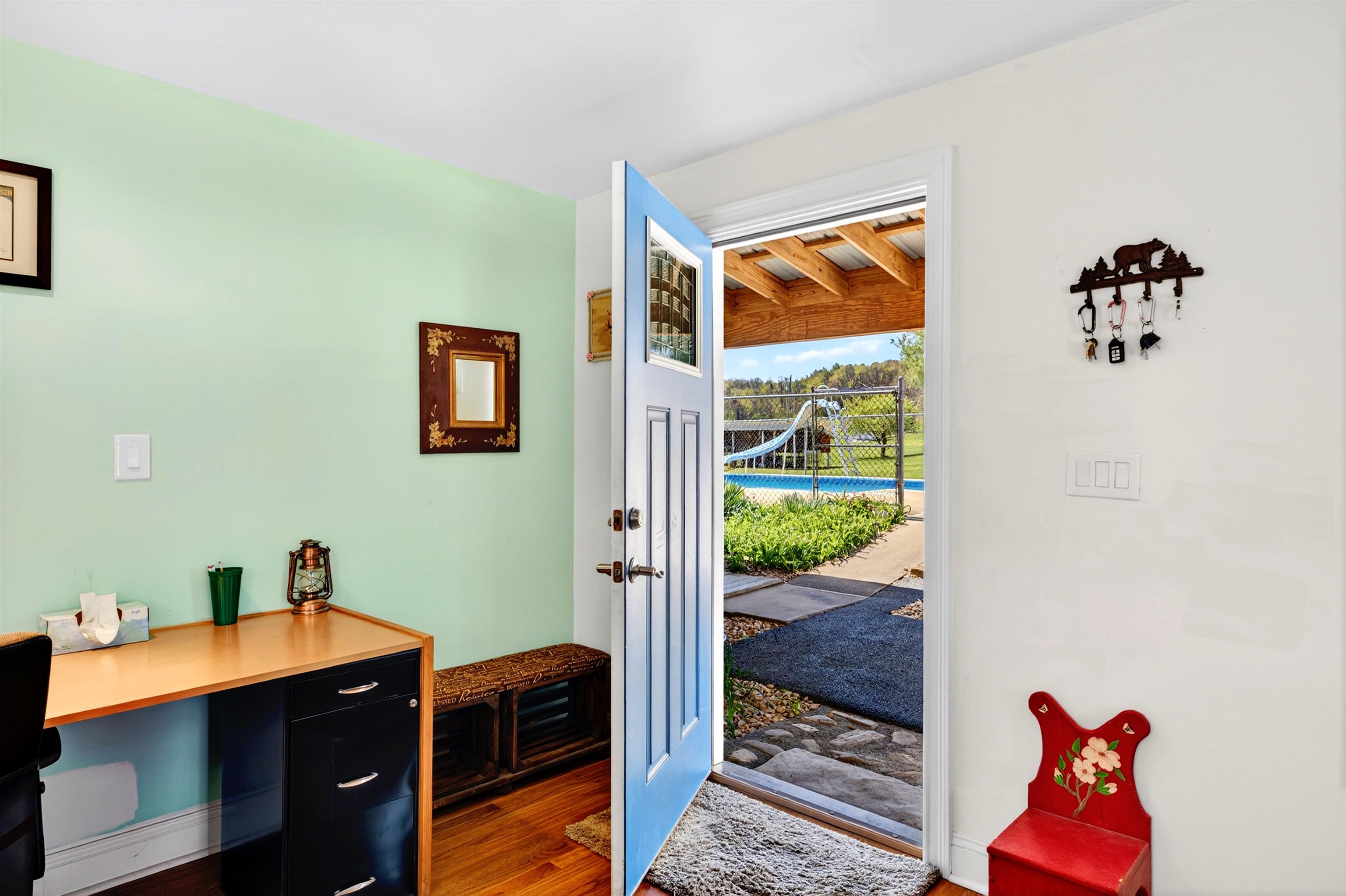 22 Oak Ridge Lane Staunton, VA 24401 - Photo 16 of 62 Flexible home office nook with space for a desk and direct access to the outdoor living area and pool — ideal for working with a view.