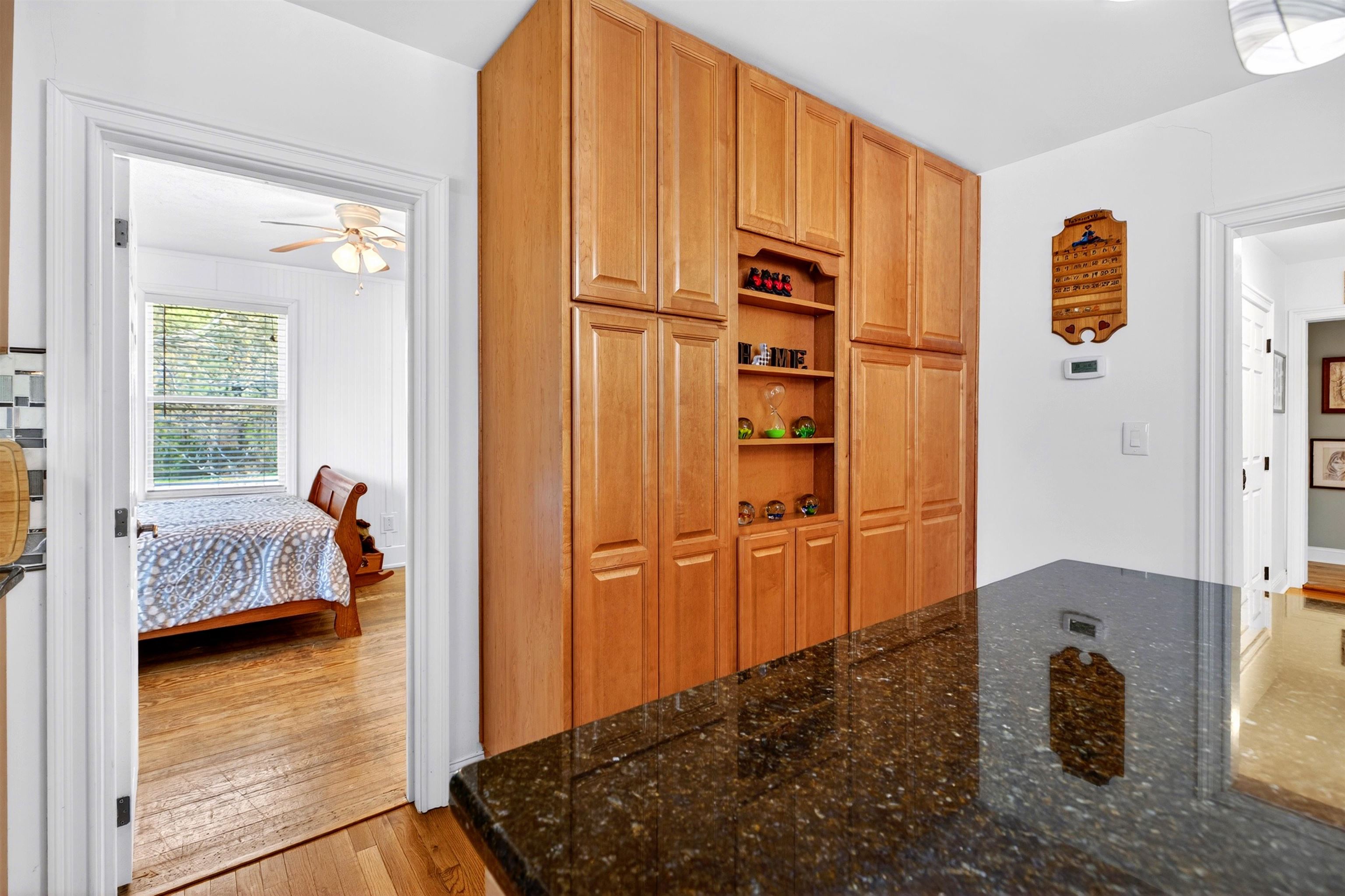 22 Oak Ridge Lane Staunton, VA 24401 - Photo 25 of 62 View from the kitchen into the secondary bedroom, offering flexible space for guests, office use, or additional living needs.