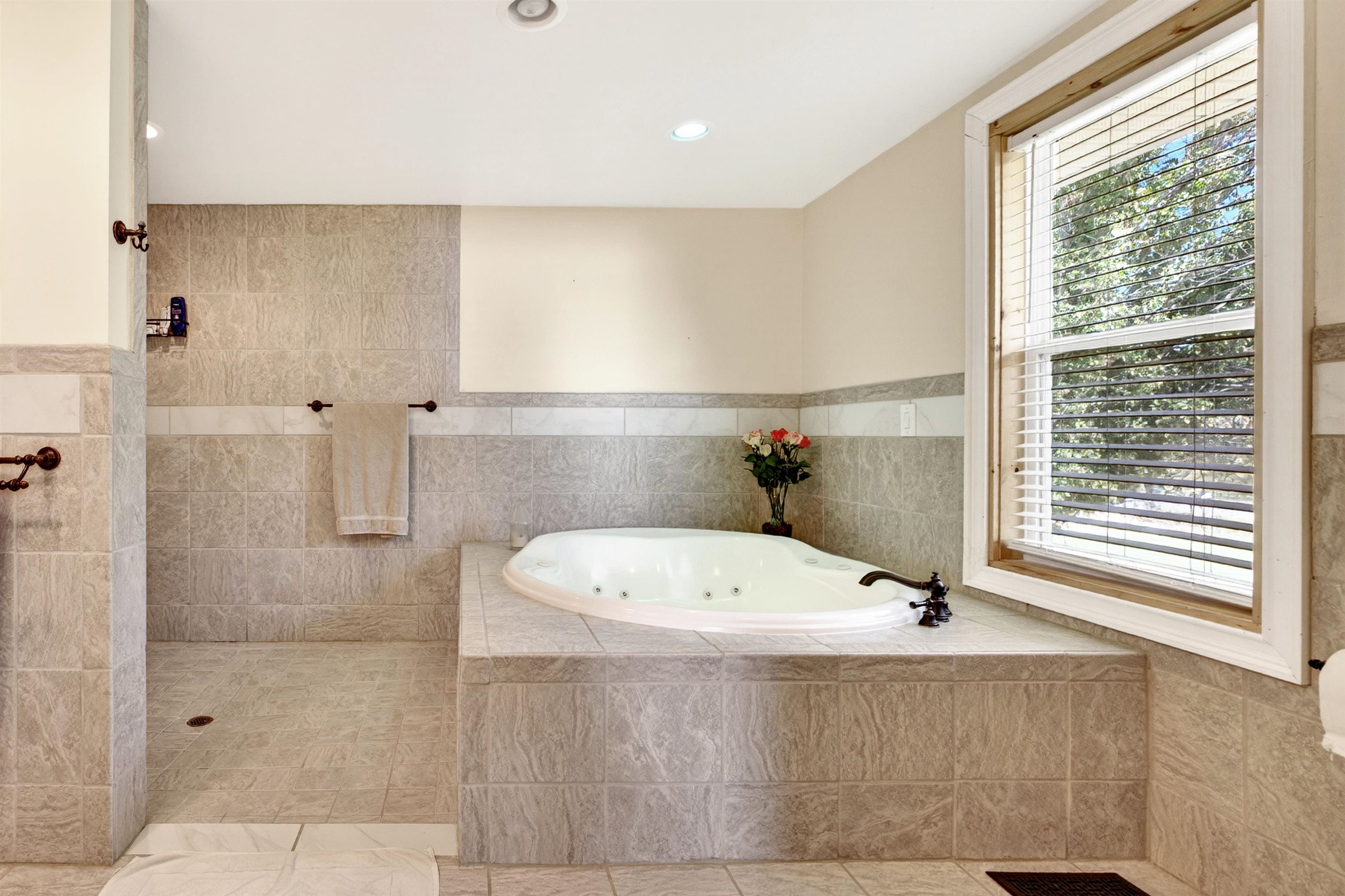 22 Oak Ridge Lane Staunton, VA 24401 - Photo 41 of 62 Spacious primary bath (approx. 13.3' x 11.9') featuring a tiled walk-in shower, oversized soaking/jetted tub, and room to comfortably move and unwind.