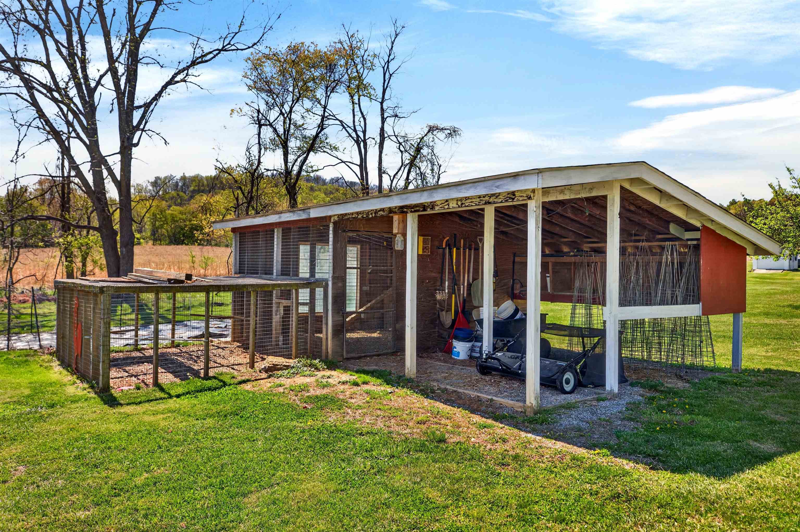 22 Oak Ridge Lane Staunton, VA 24401 - Photo 49 of 62 Fenced chicken coop area offering a great setup for small-scale homesteading, fresh eggs, or hobby farming.
