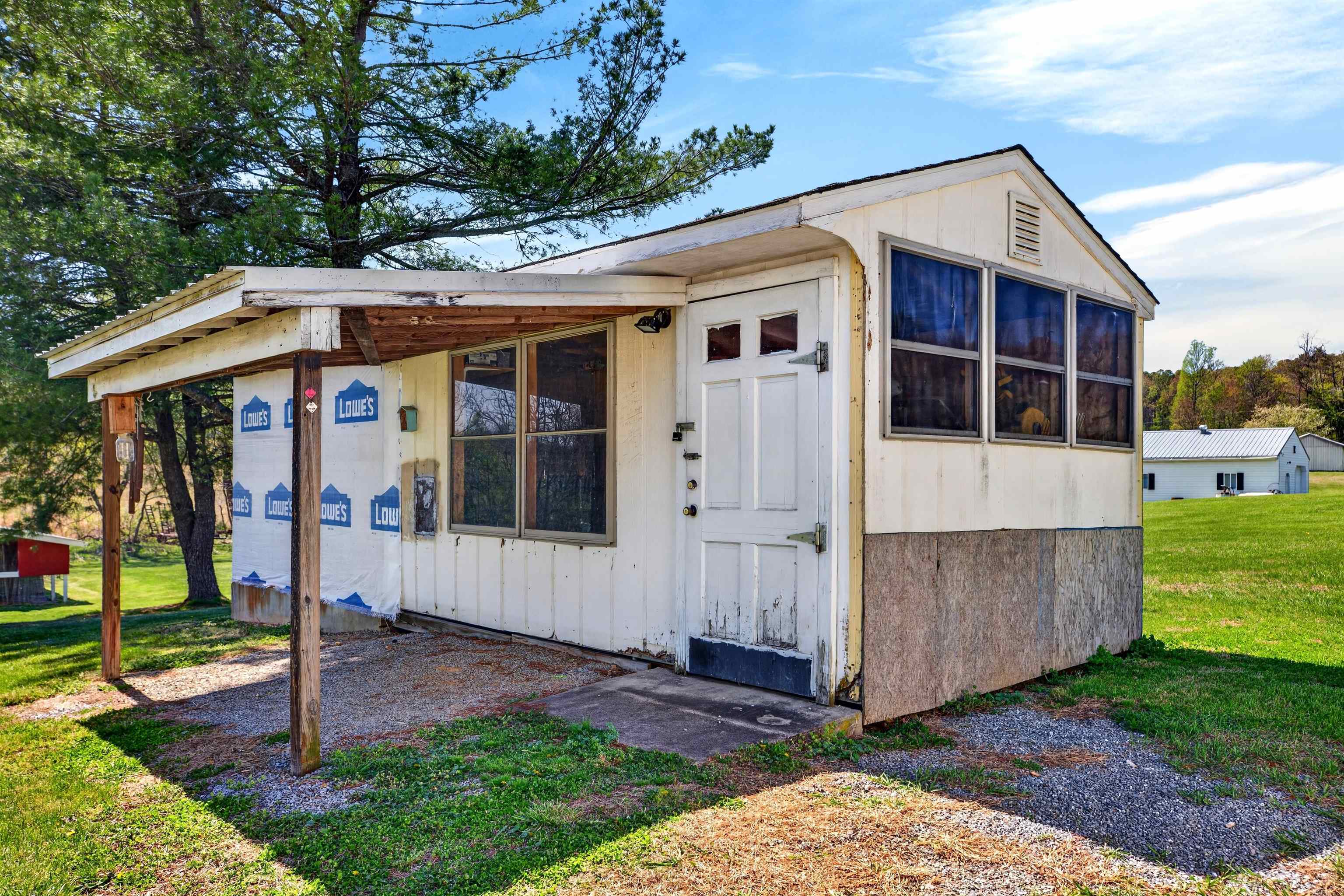 22 Oak Ridge Lane Staunton, VA 24401 - Photo 51 of 62 Approx. 240 sq ft workshop with electricity, ideal for projects, hobbies, or additional storage space.