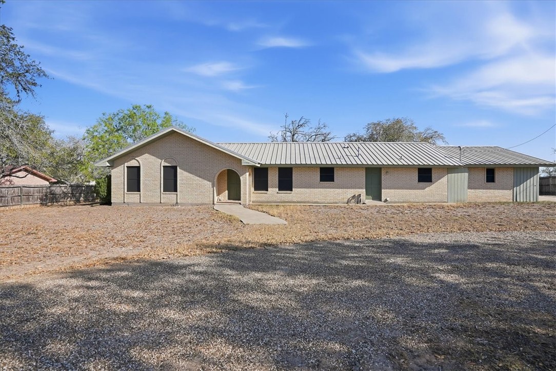 1309 Burleson Street George West, TX 78022 - Photo 1 of 32 a front view of a house with a outdoor space