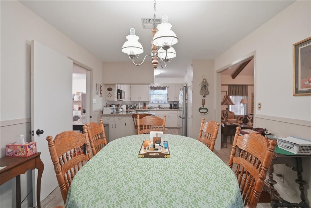 1309 Burleson Street George West, TX 78022 - Photo 12 of 32 a view of a dining room with furniture