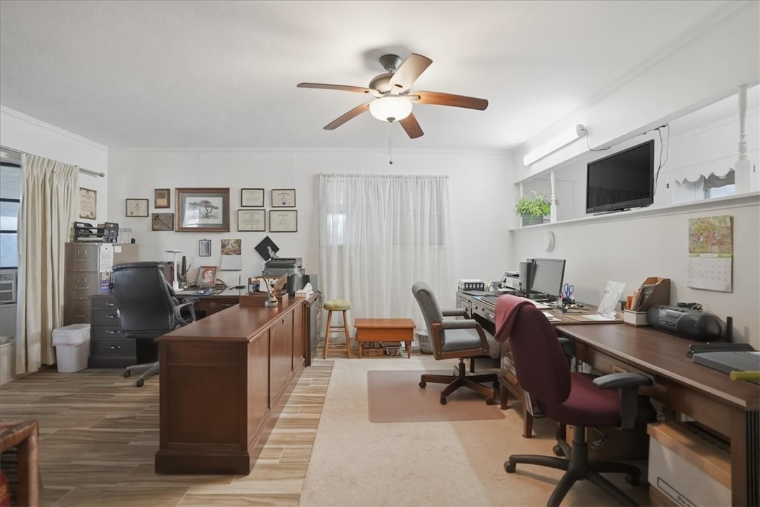 1309 Burleson Street George West, TX 78022 - Photo 13 of 32 a view of a workspace with furniture and a livingroom