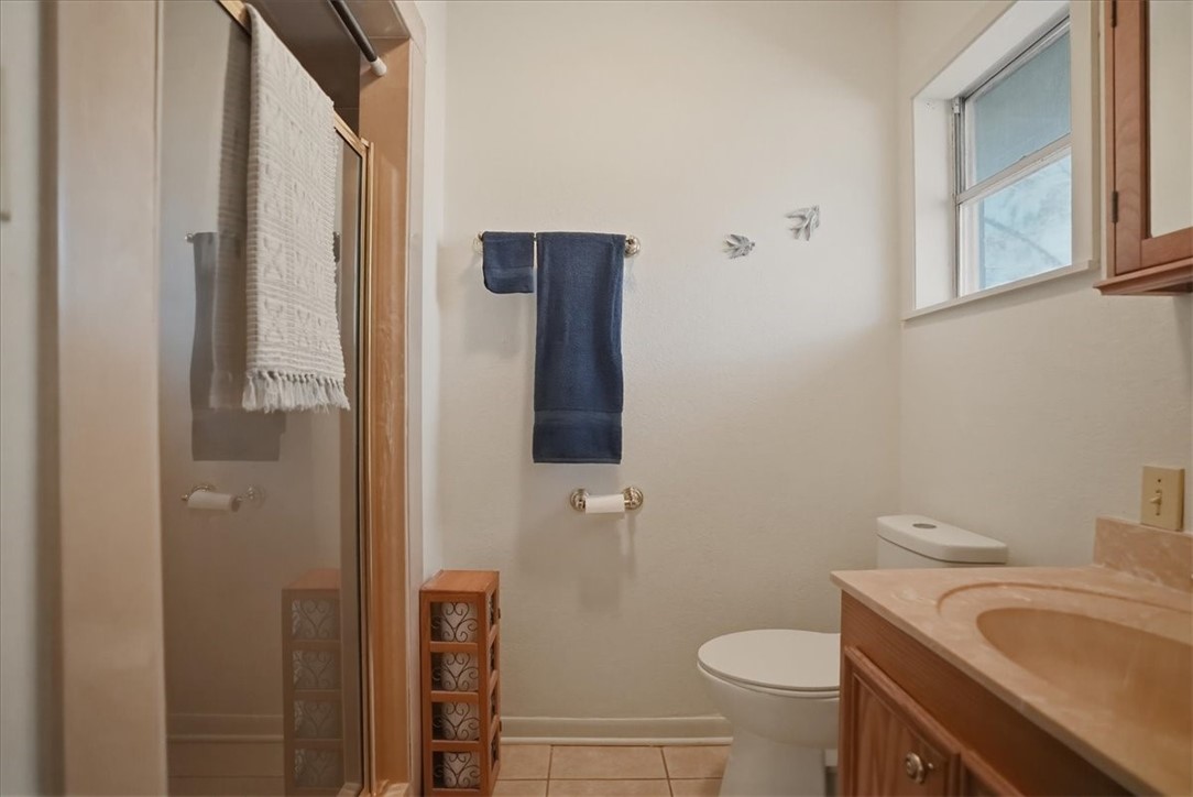 1309 Burleson Street George West, TX 78022 - Photo 23 of 32 a bathroom with a sink and toilet