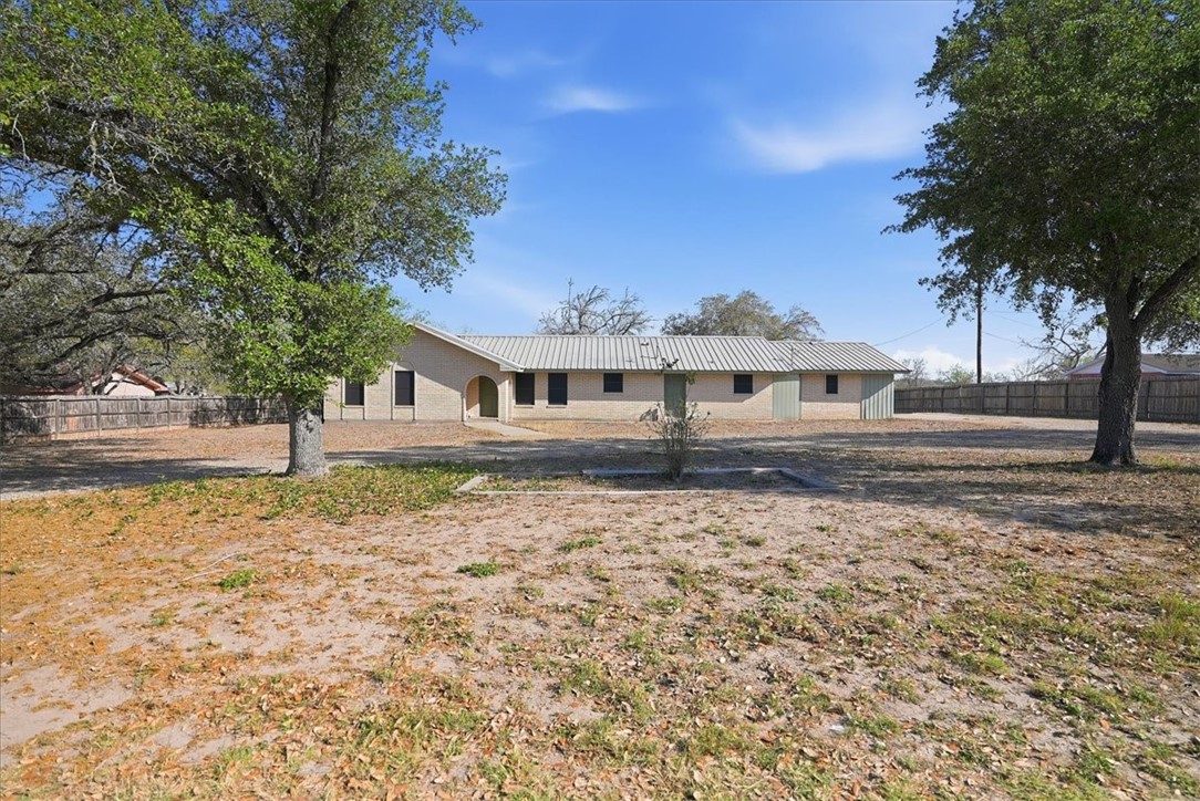 1309 Burleson Street George West, TX 78022 - Photo 26 of 32 a front view of a house with garden