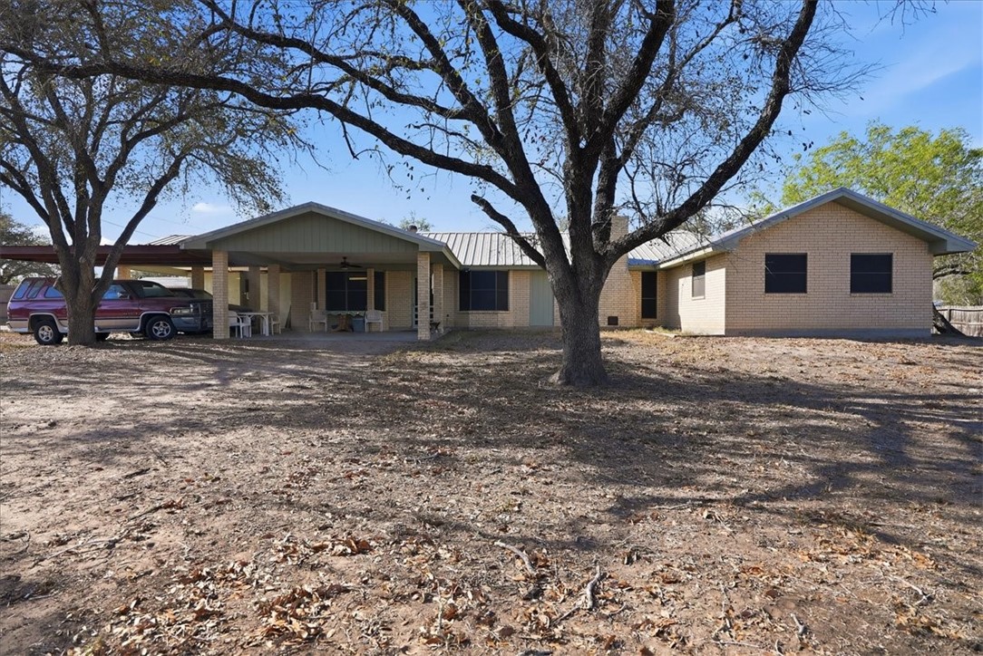 1309 Burleson Street George West, TX 78022 - Photo 28 of 32 a front view of a house with a yard