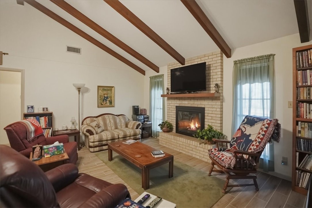 1309 Burleson Street George West, TX 78022 - Photo 4 of 32 a living room with furniture and a fireplace