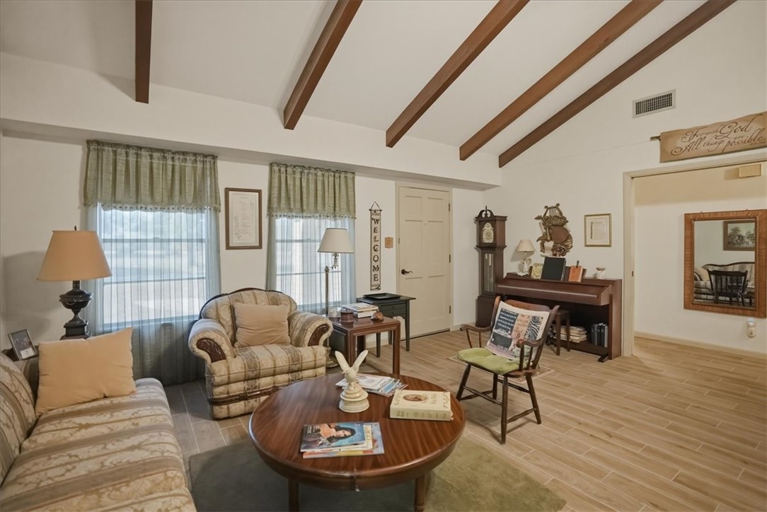1309 Burleson Street George West, TX 78022 - Photo 6 of 32 a living room with furniture and a wooden floor