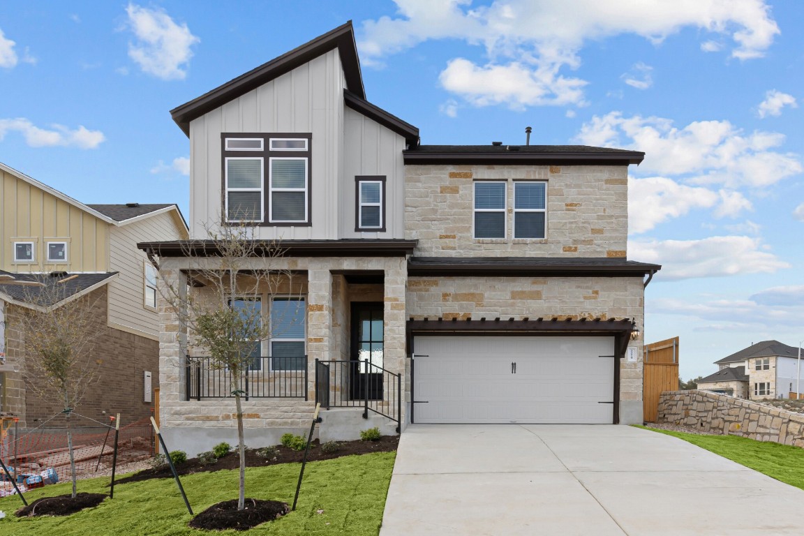 a front view of a house with garden