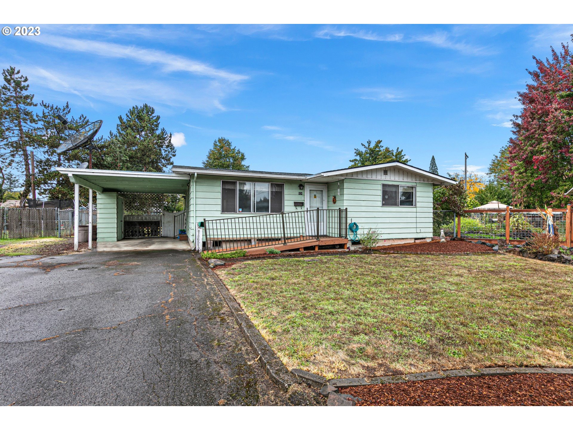 824 20th Street Springfield, OR 97477 - Photo 1 of 44 a white house with a large garden space
