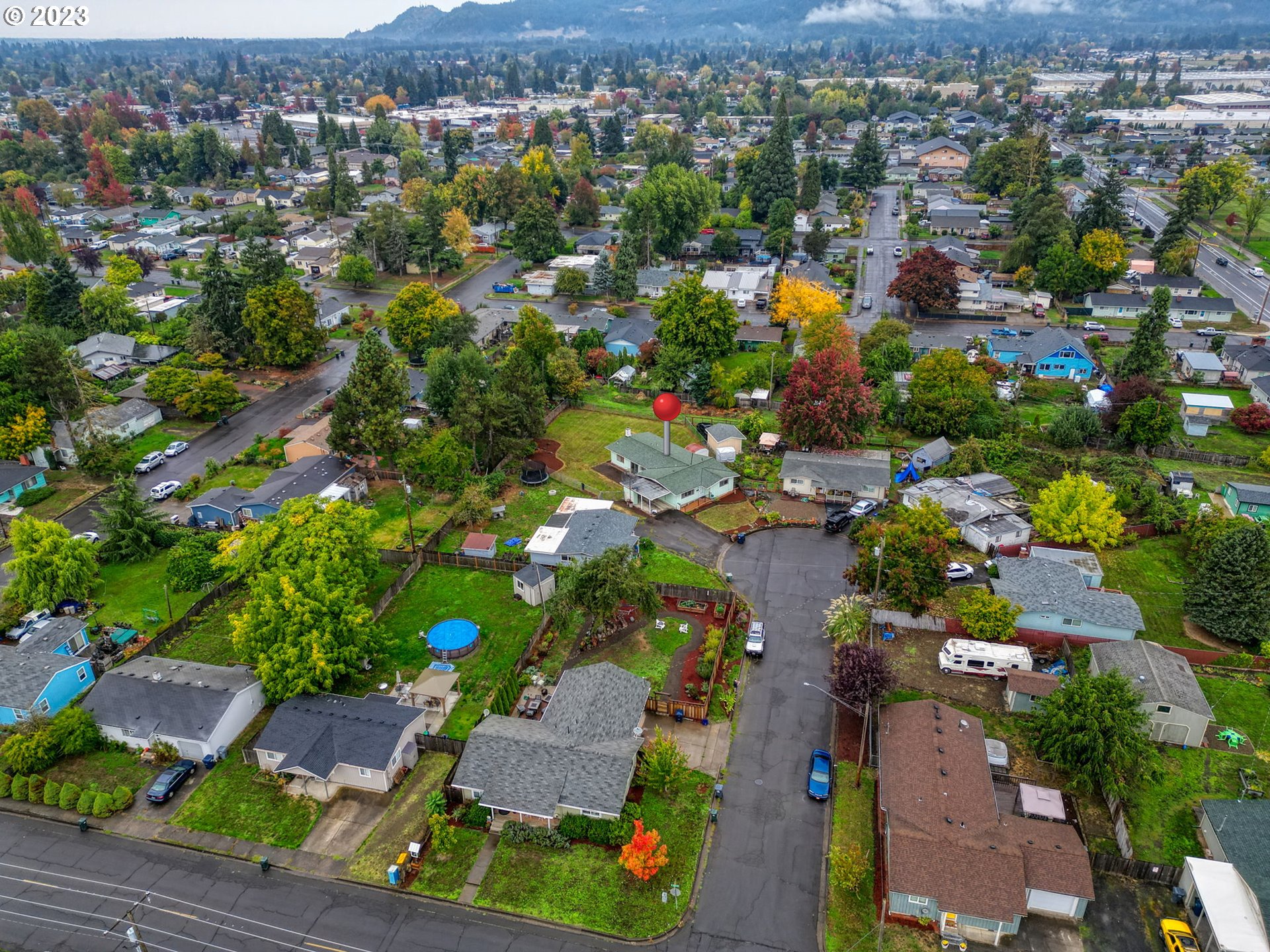 824 20th Street Springfield, OR 97477 - Photo 44 of 44 an aerial view of residential house with outdoor space and covered with tall trees