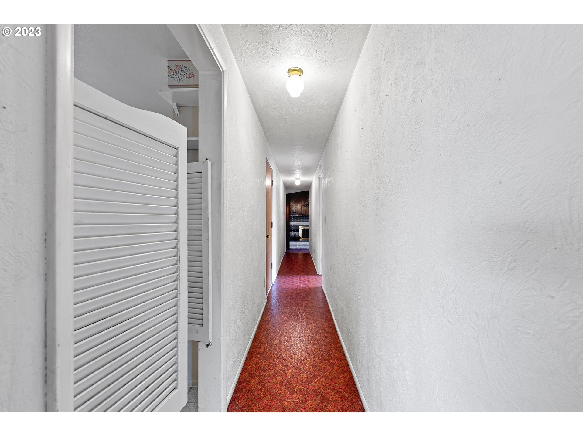 824 20th Street Springfield, OR 97477 - Photo 9 of 44 a view of a hallway with wooden floor