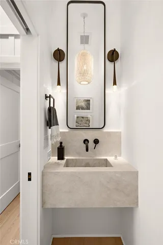 a bathroom with a sink and a mirror