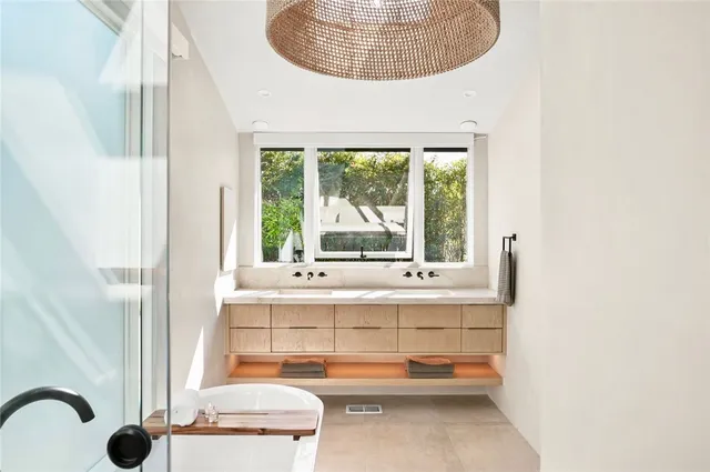 a bathroom with a shower a toilet and sink