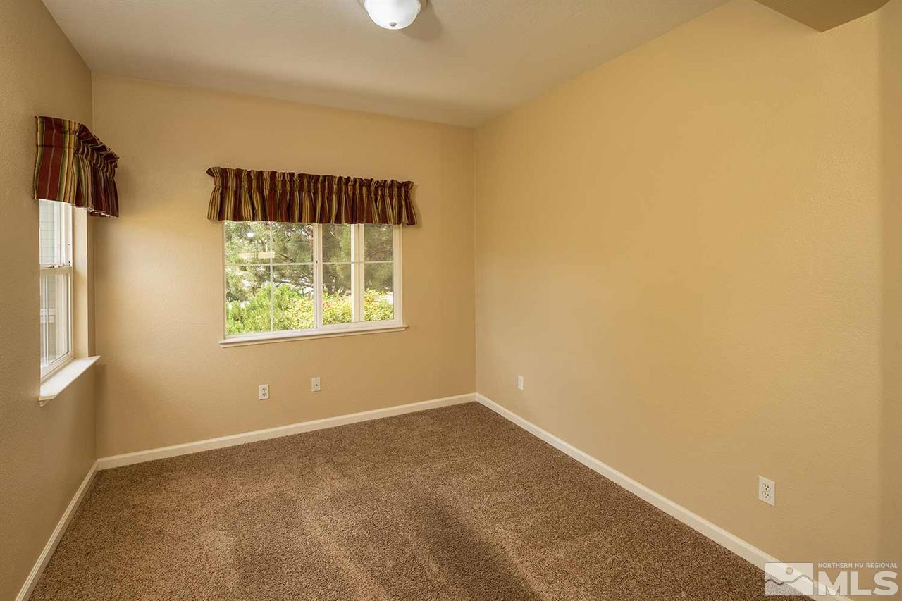 4599 Keyhaven Drive Reno, NV 89502 - Photo 13 of 28 an empty room with windows
