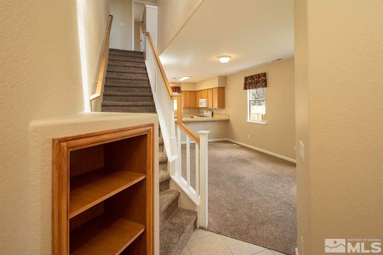 4599 Keyhaven Drive Reno, NV 89502 - Photo 14 of 28 a view of a livingroom with wooden floor and staircase
