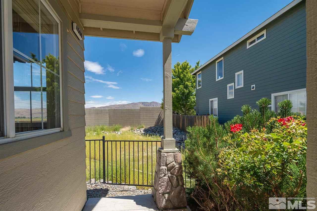 4599 Keyhaven Drive Reno, NV 89502 - Photo 2 of 28 a view of a potted flower in front of a glass door