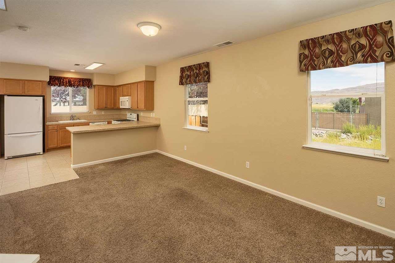 4599 Keyhaven Drive Reno, NV 89502 - Photo 4 of 28 a living room with stainless steel appliances granite countertop furniture and a window