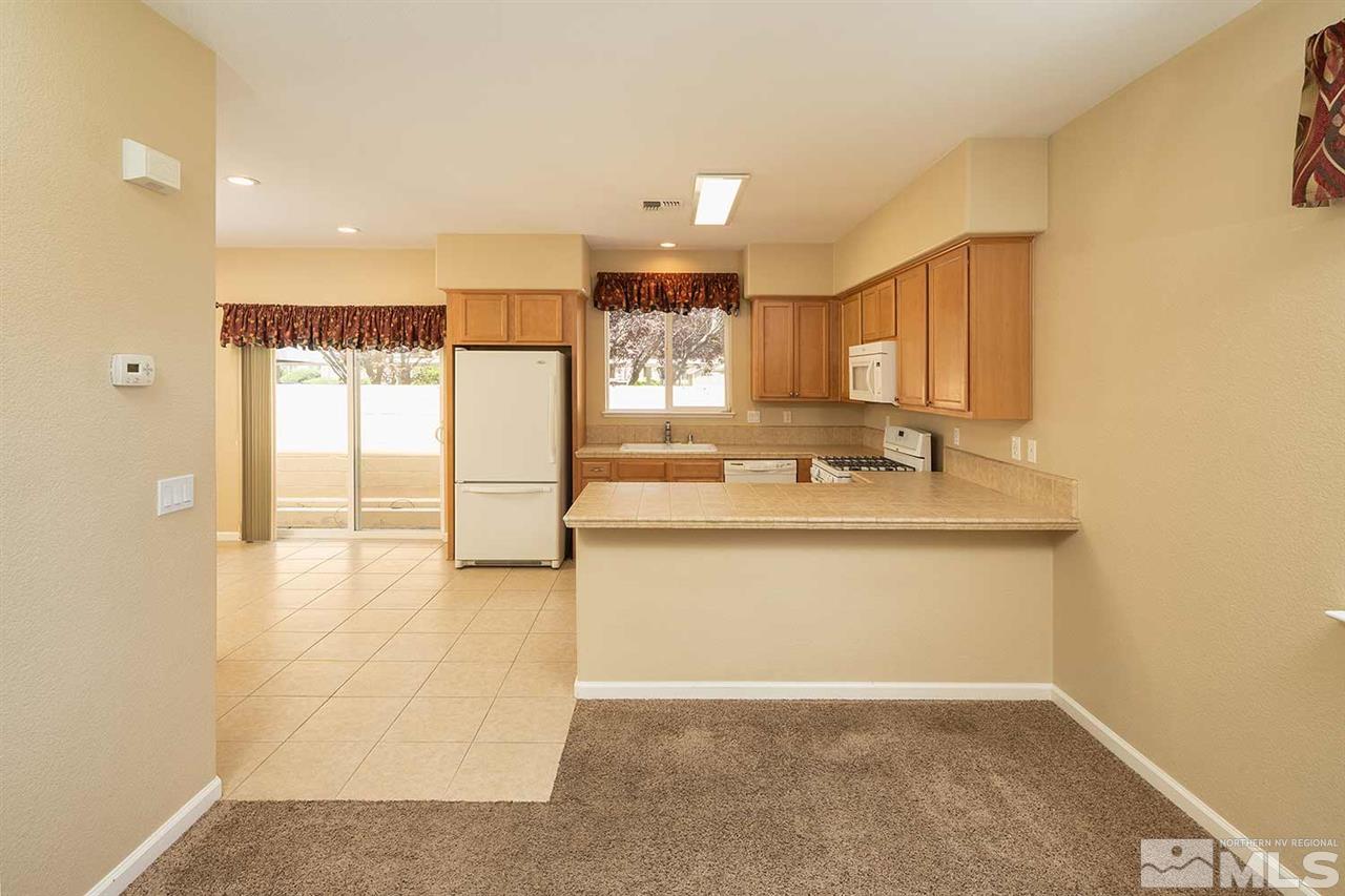 4599 Keyhaven Drive Reno, NV 89502 - Photo 5 of 28 a bathroom with a sink a mirror and a shower