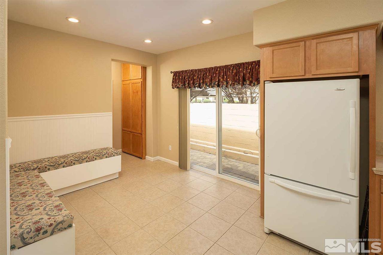 4599 Keyhaven Drive Reno, NV 89502 - Photo 8 of 28 a view of an empty room with a refrigerator