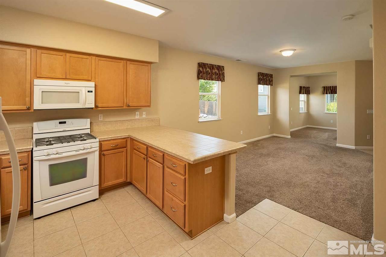 4599 Keyhaven Drive Reno, NV 89502 - Photo 10 of 28 a kitchen with a stove and a sink