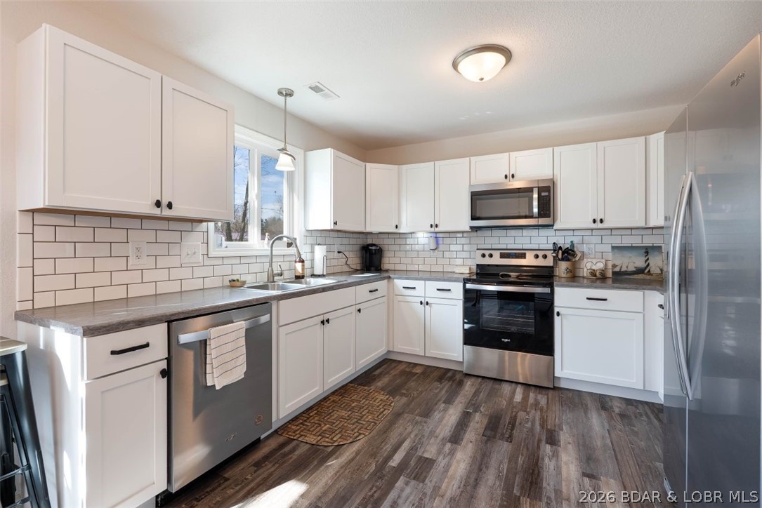 208 East Jemphrey Road Eldon, MO 65026 - Photo 11 of 45 Multitude of cabinets and counters.