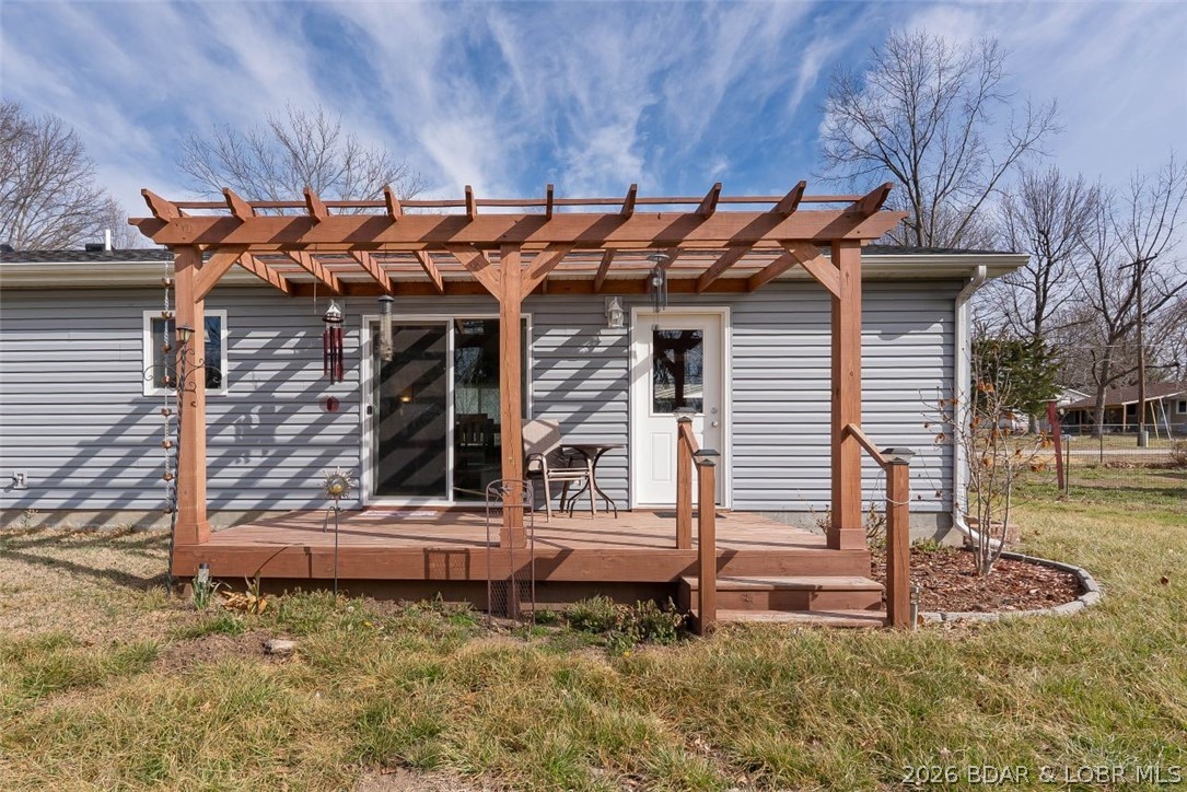 208 East Jemphrey Road Eldon, MO 65026 - Photo 28 of 45 Open pergola has access to the dining area and gar