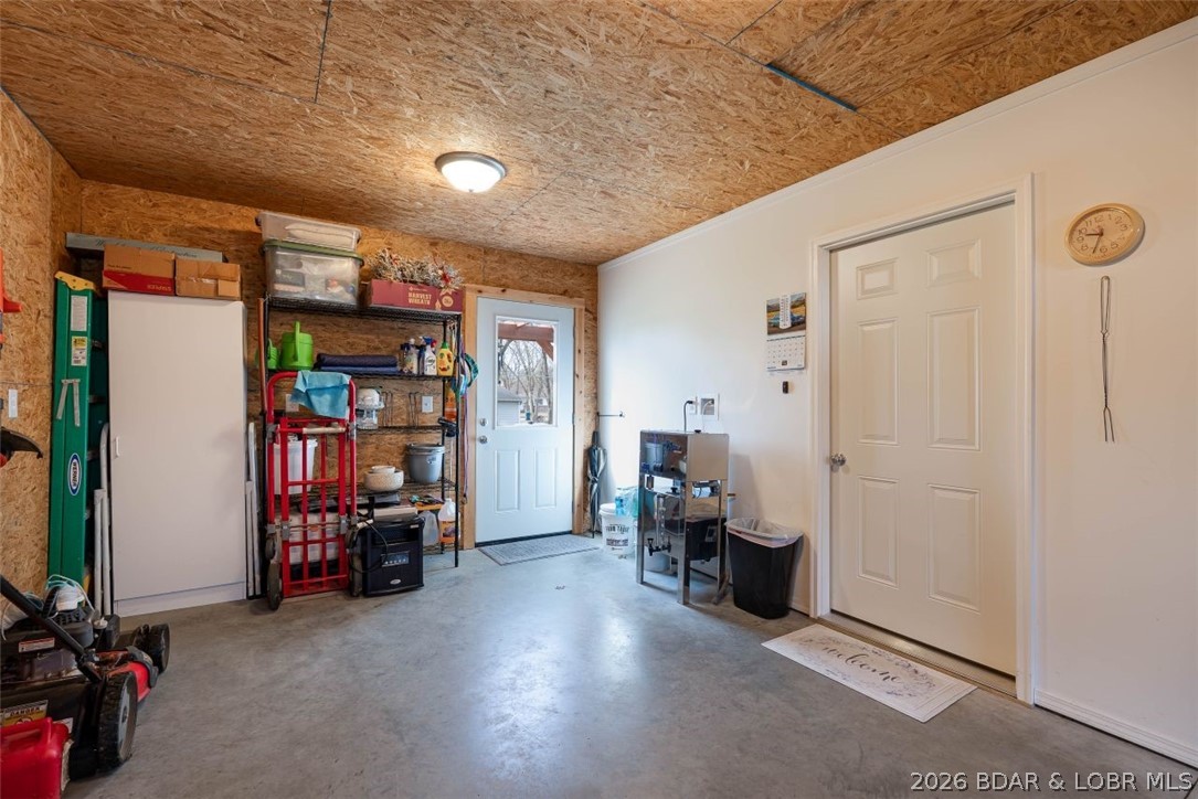 208 East Jemphrey Road Eldon, MO 65026 - Photo 29 of 45 Garage interior with level access to back yard and